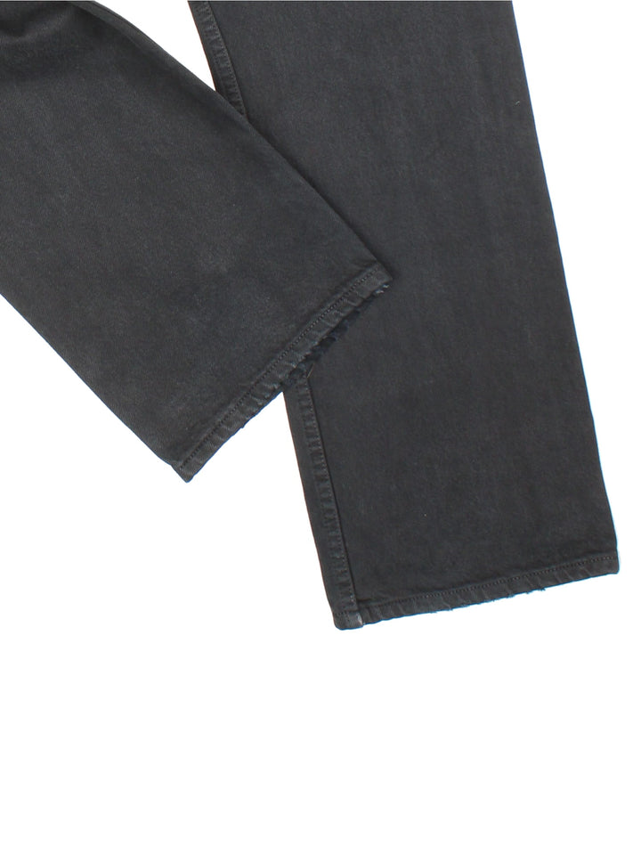 Levi Strauss 501 Jeans in black colourway with multiple pockets and the logo tab embroidered on the back.