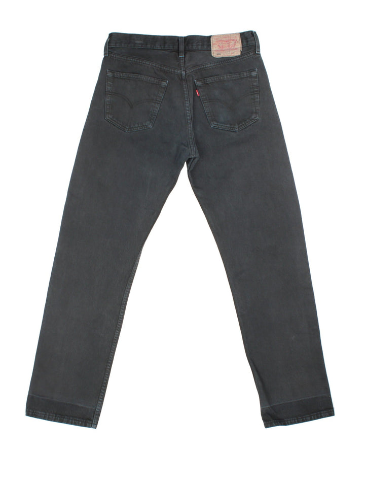 Levi Strauss 501 Jeans in black colourway with multiple pockets and the logo tab embroidered on the back.