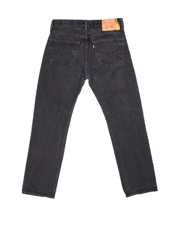 Levi Strauss 501 Jeans in black colourway with multiple pockets and the logo tab embroidered on the back.