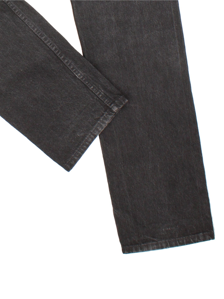 Levi Strauss 501 Jeans in black colourway with multiple pockets and the logo tab embroidered on the back.