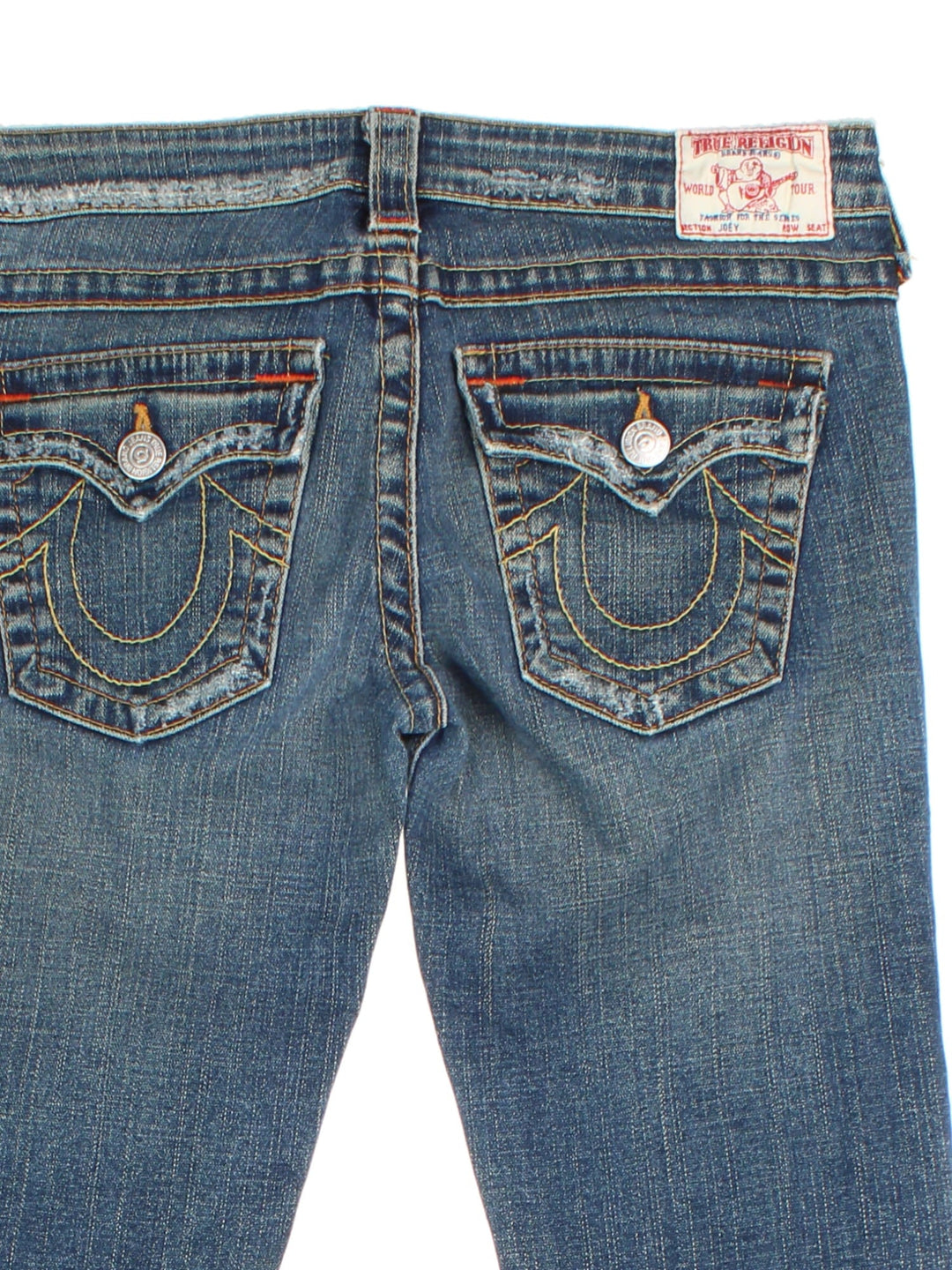 True Religion Flared Y2K Jeans in blue colourway with multiple pockets, rip features, and the logo embroidered on the back pockets.