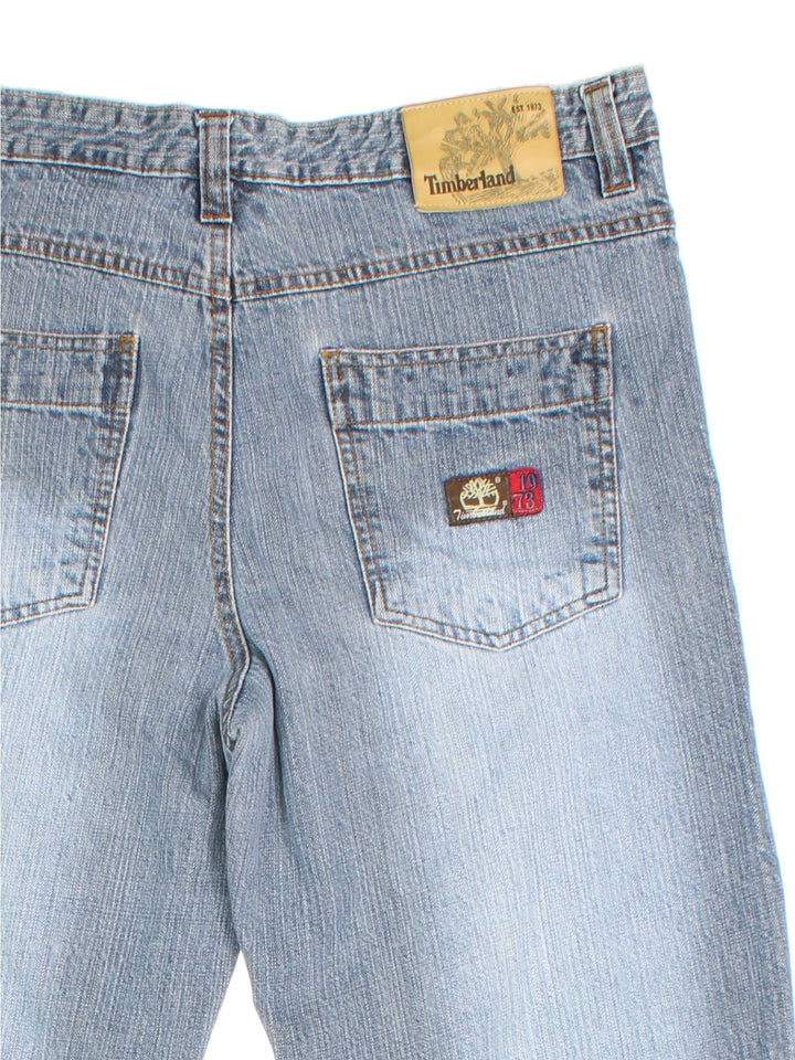 Timberland jeans in faded light blue colourway with multiple pockets and the logo embroidered on the front and back.