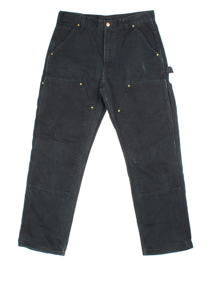 Carhartt Double Knee Jeans in black colourway with multiple pockets and the logo embroidered on the back.