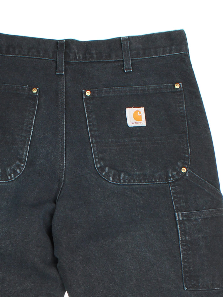 Carhartt Double Knee Jeans in black colourway with multiple pockets and the logo embroidered on the back.