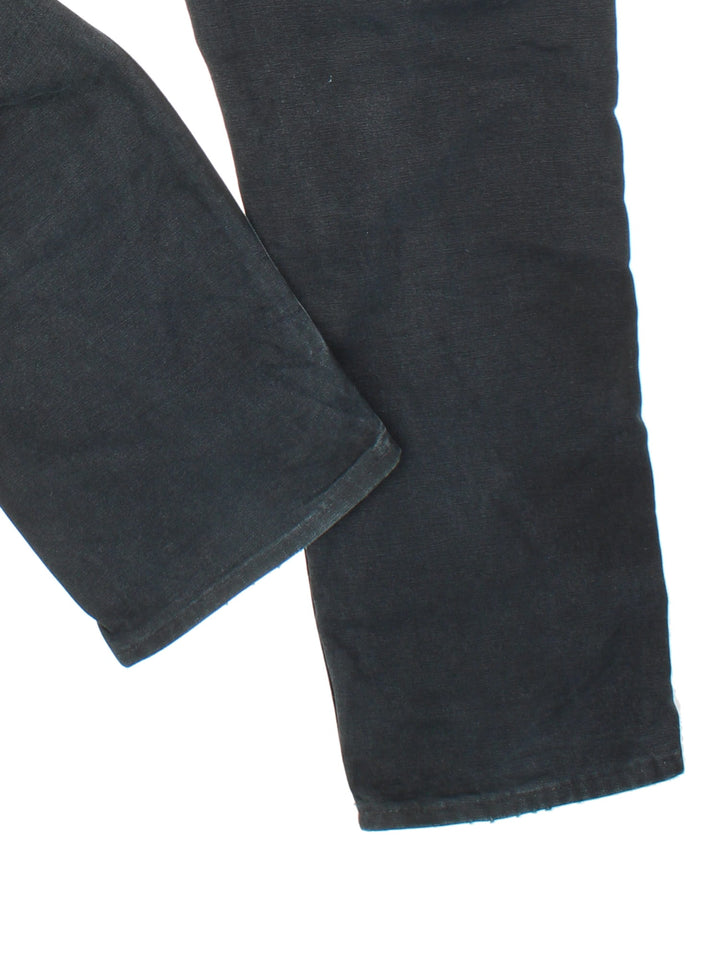 Carhartt Double Knee Jeans in black colourway with multiple pockets and the logo embroidered on the back.