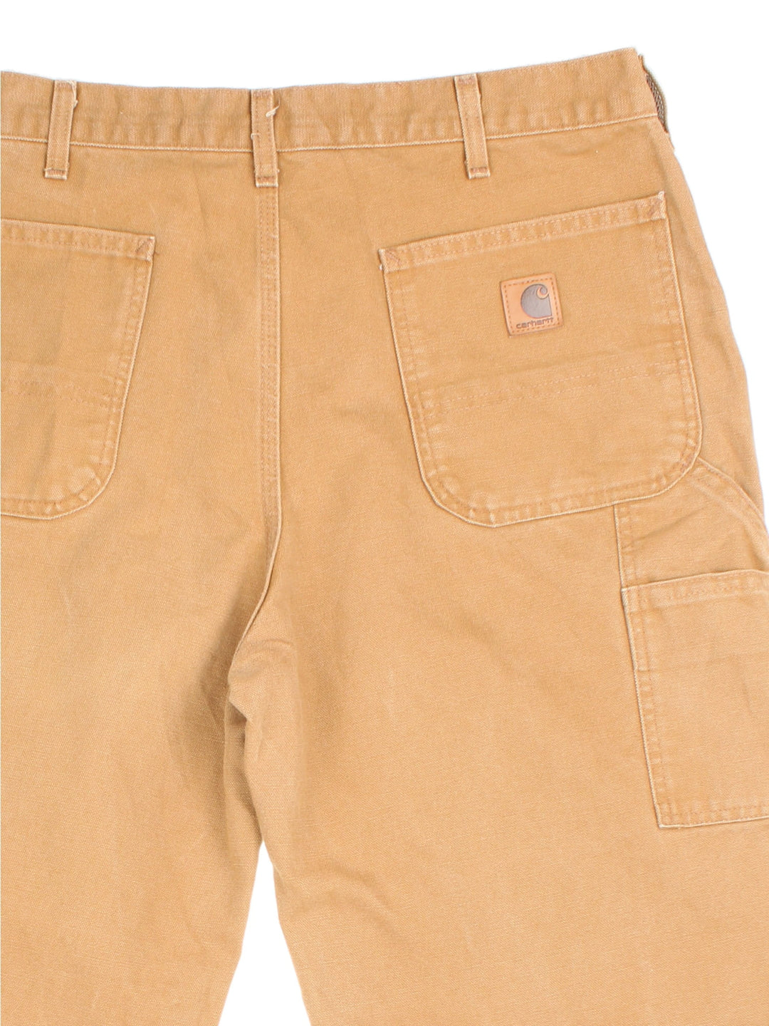 Carhartt Carpenter Jeans in tan colourway with multiple pockets and the logo embroidered on the back.