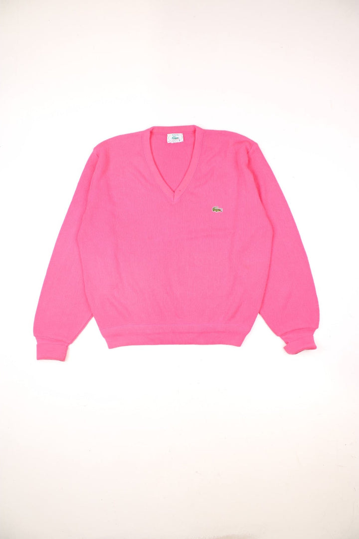 Vintage Izod Lacoste Sweater in a pink colourway with the logo embroidered on the front and has a v neck collar. 