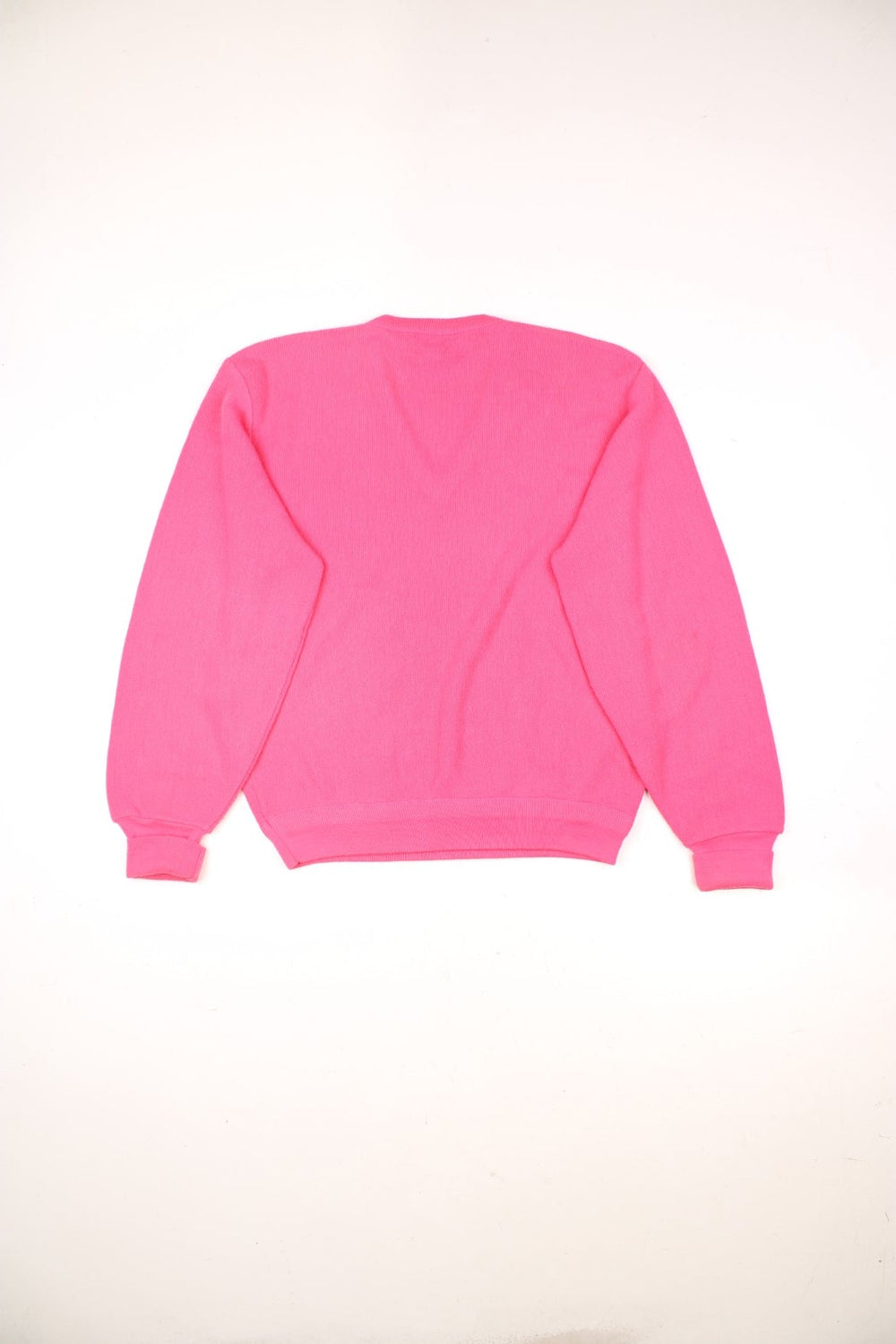 Vintage Izod Lacoste Sweater in a pink colourway with the logo embroidered on the front and has a v neck collar. 