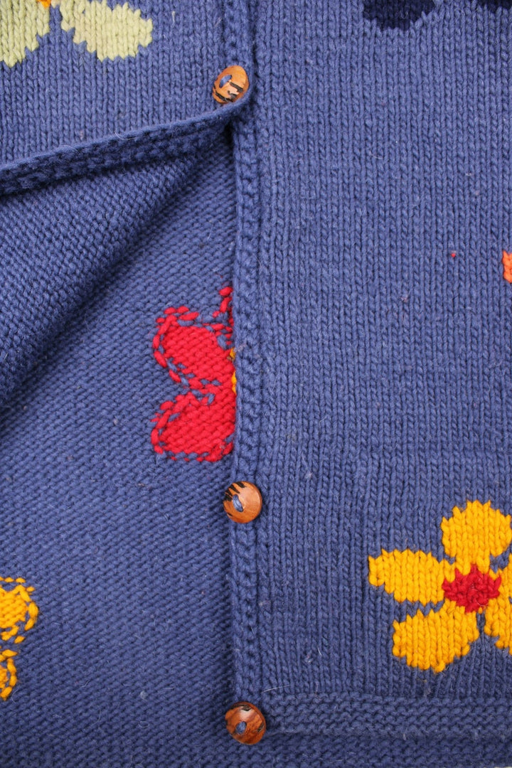 Vintage Pachamama Floral Knitted Cardigan in a blue colourway with multicoloured flowered embroidered all over, buttons up and has side pockets. 