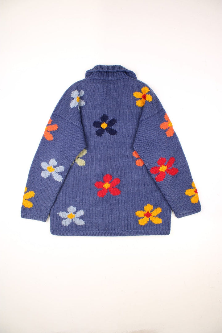 Vintage Pachamama Floral Knitted Cardigan in a blue colourway with multicoloured flowered embroidered all over, buttons up and has side pockets. 