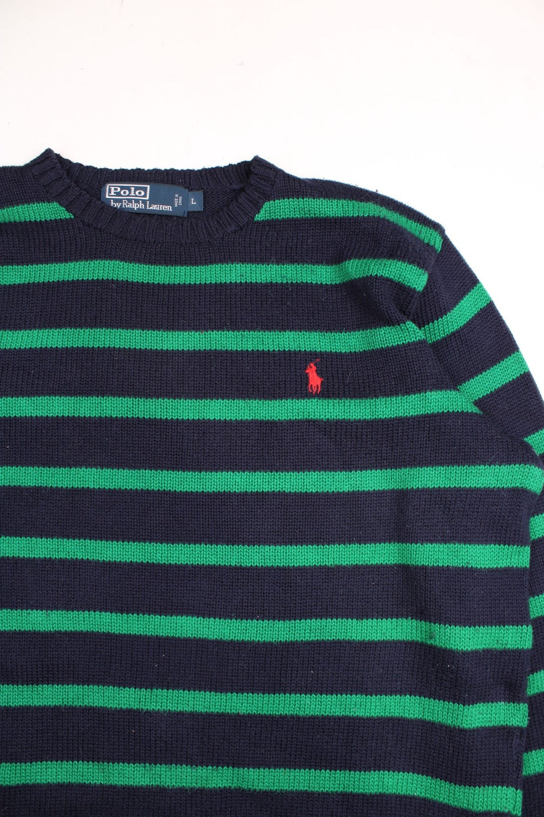 Ralph Lauren cotton jumper in a navy blue colourway with green stripes and the Ralph Lauren logo embroidered in red on the front.