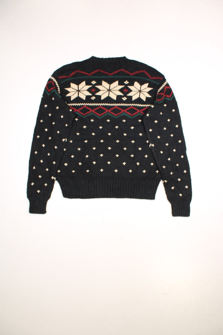 Ralph Lauren winter jumper in a black colourway. The knit has a Norwegian style pattern with snowflakes across the chest.