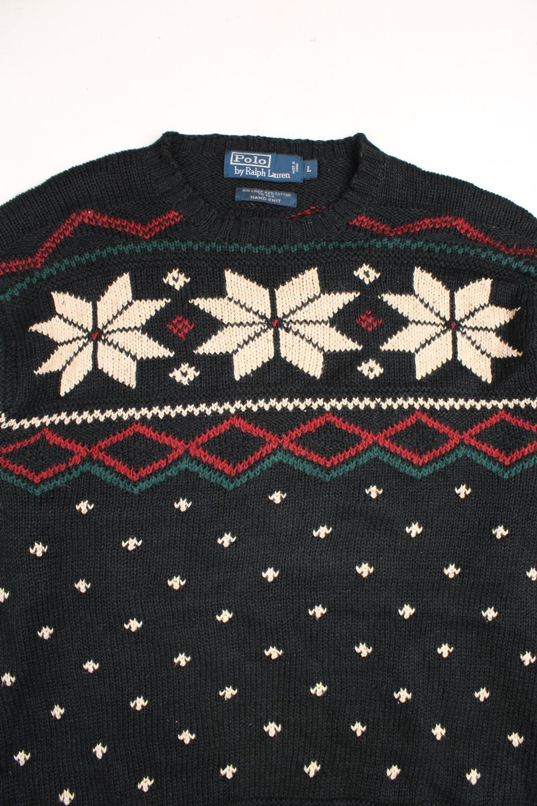 Ralph Lauren winter jumper in a black colourway. The knit has a Norwegian style pattern with snowflakes across the chest.