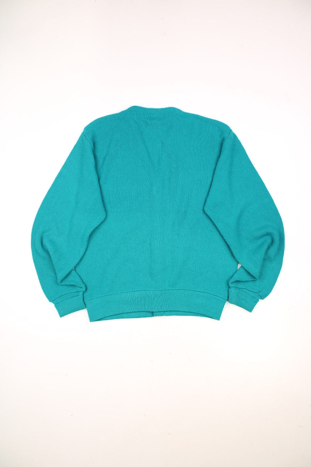 Izod Lacoste Cardigan in a turquoise colourway with the logo embroidered on the front and buttons up with a v neck collar. 