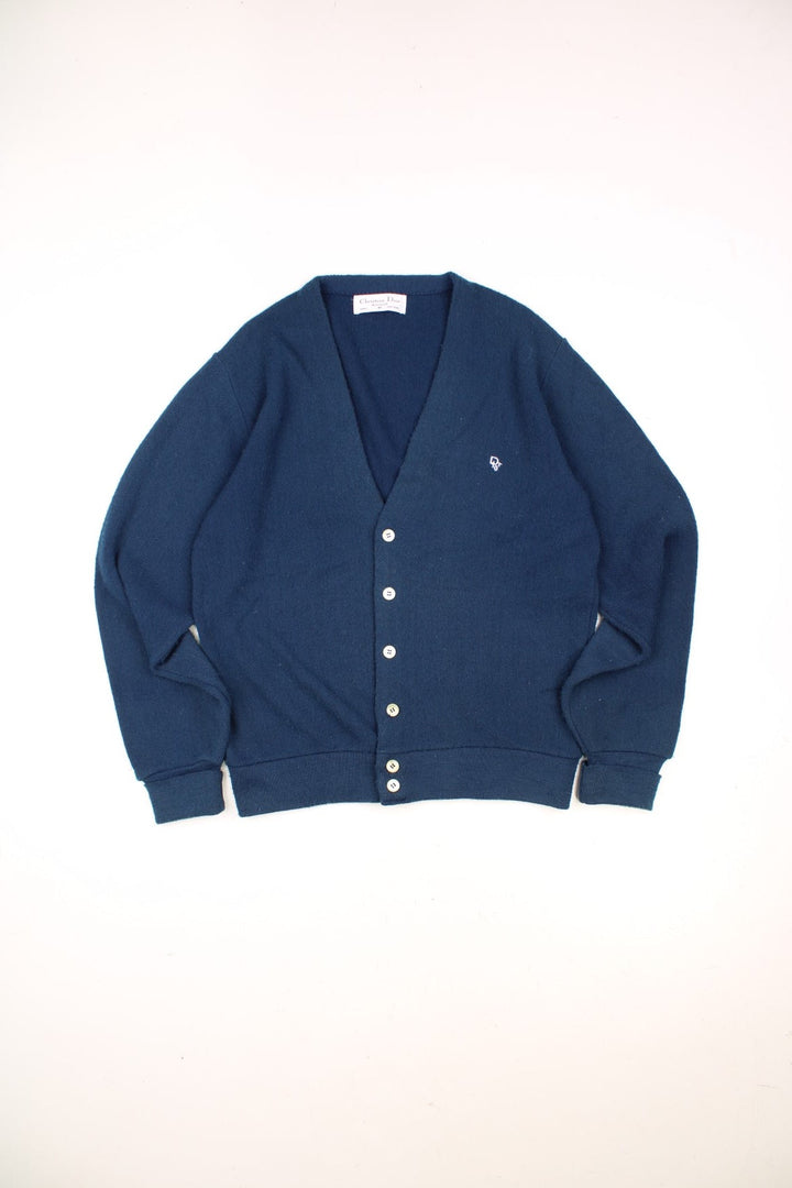 Vintage Christian Dior Knitted Cardigan in a navy blue colourway with the logo embroiderd on the chest and buttons up with a v neck collar. 