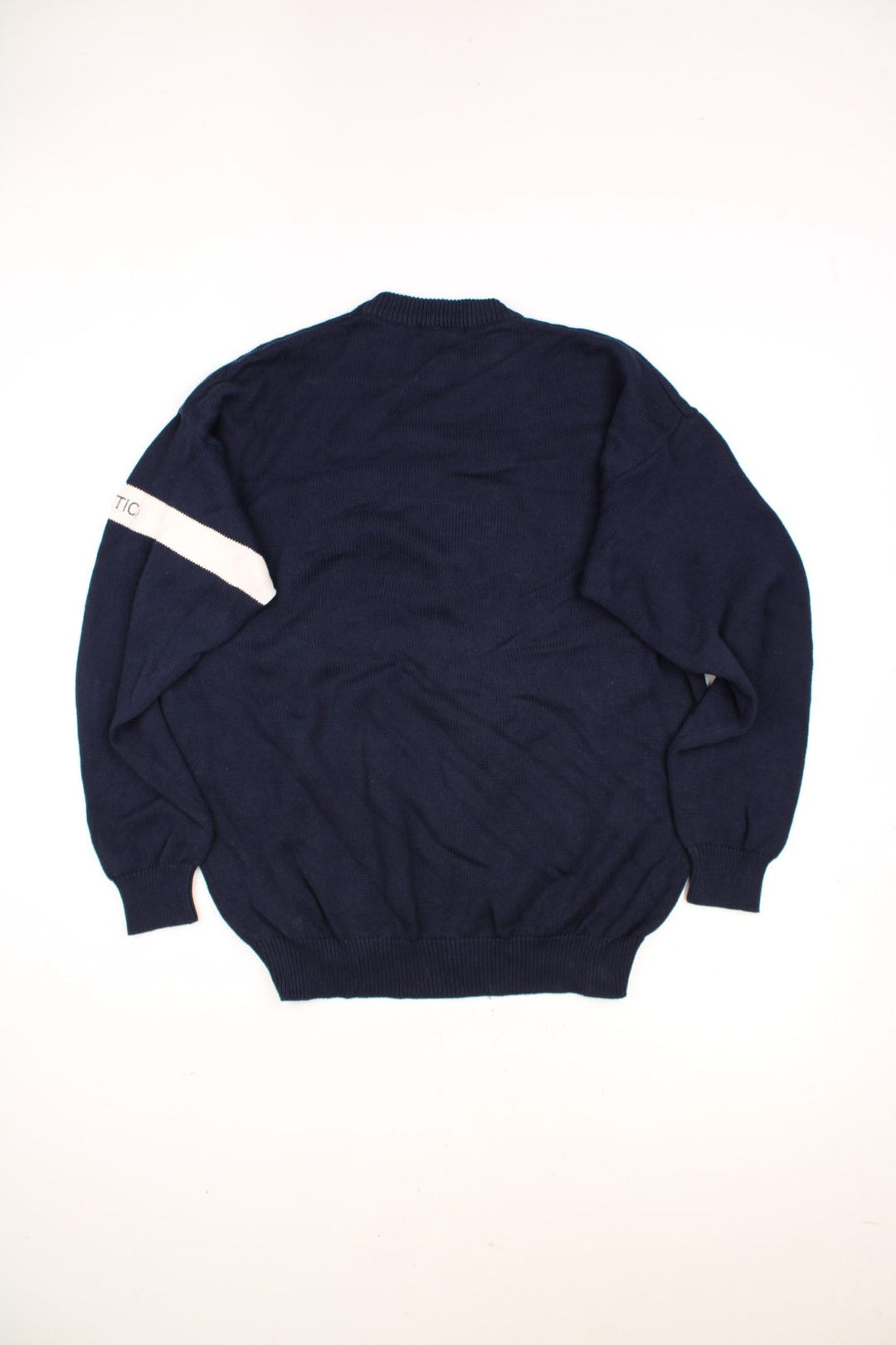 Nautica American Yachting Knitted Jumper in a navy blue and white colourway with the spell out logo and yatch graphic embroidered on the front. 