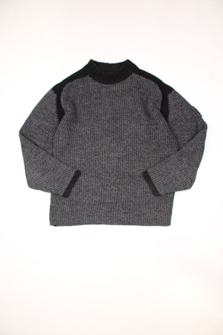 Grey and black Kickers funnel neck knit jumper with embroidered badge on the sleeve.