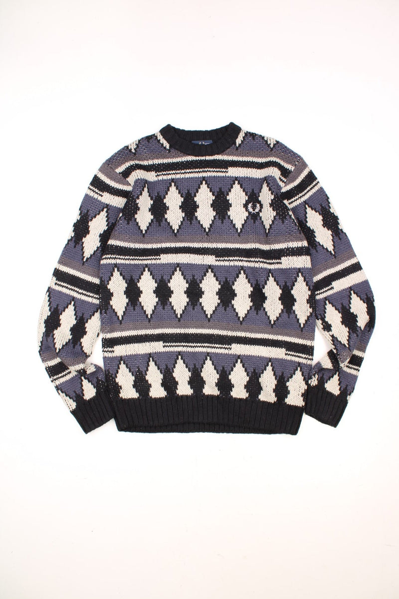 Fred Pattern Knitted Jumper in a grey, blue, black and white diamond patterned colourway with the logo embroiderd on the chest. 