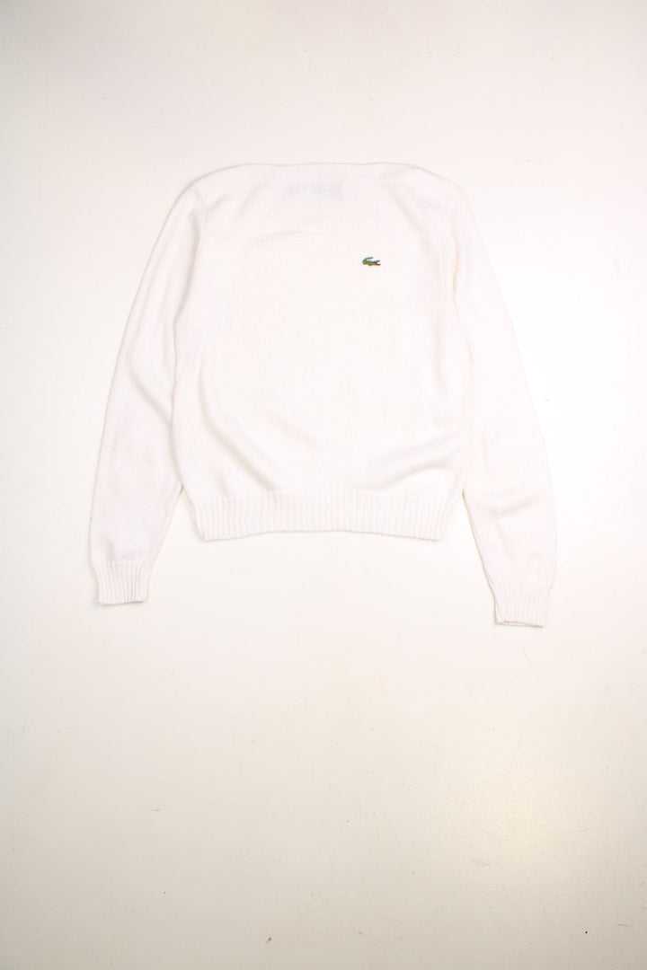 Lacoste jumper in a white colourway with a slash neck, ribbed knitted pattern across the chest and the Lacoste logo embroidered on the front.