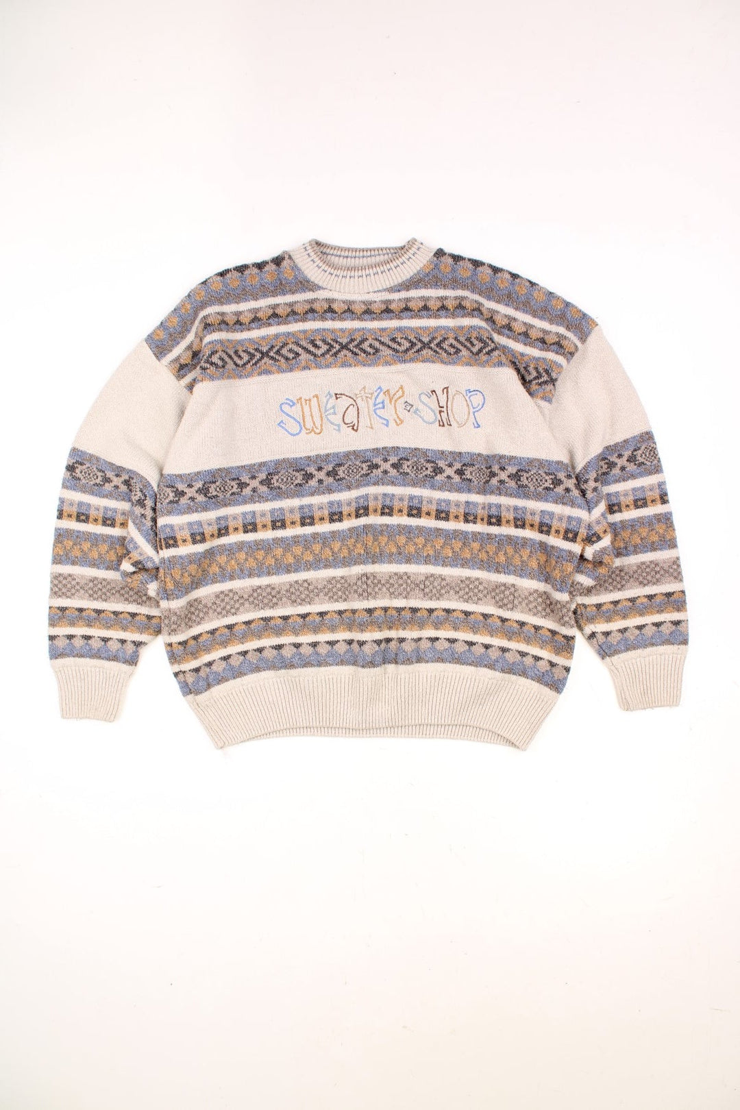 Vintage The Sweater Shop Patterned Knitted Jumper in a cream, blue, black and orange striped colourway with the spell out logo embroiderd across the front. 