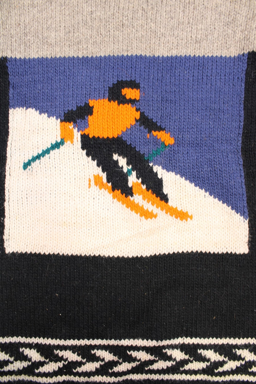 Vintage Yarina Wool Skiing Knitted Jumper in a grey and black colourway with skiing slopes graphic on the front and back. 