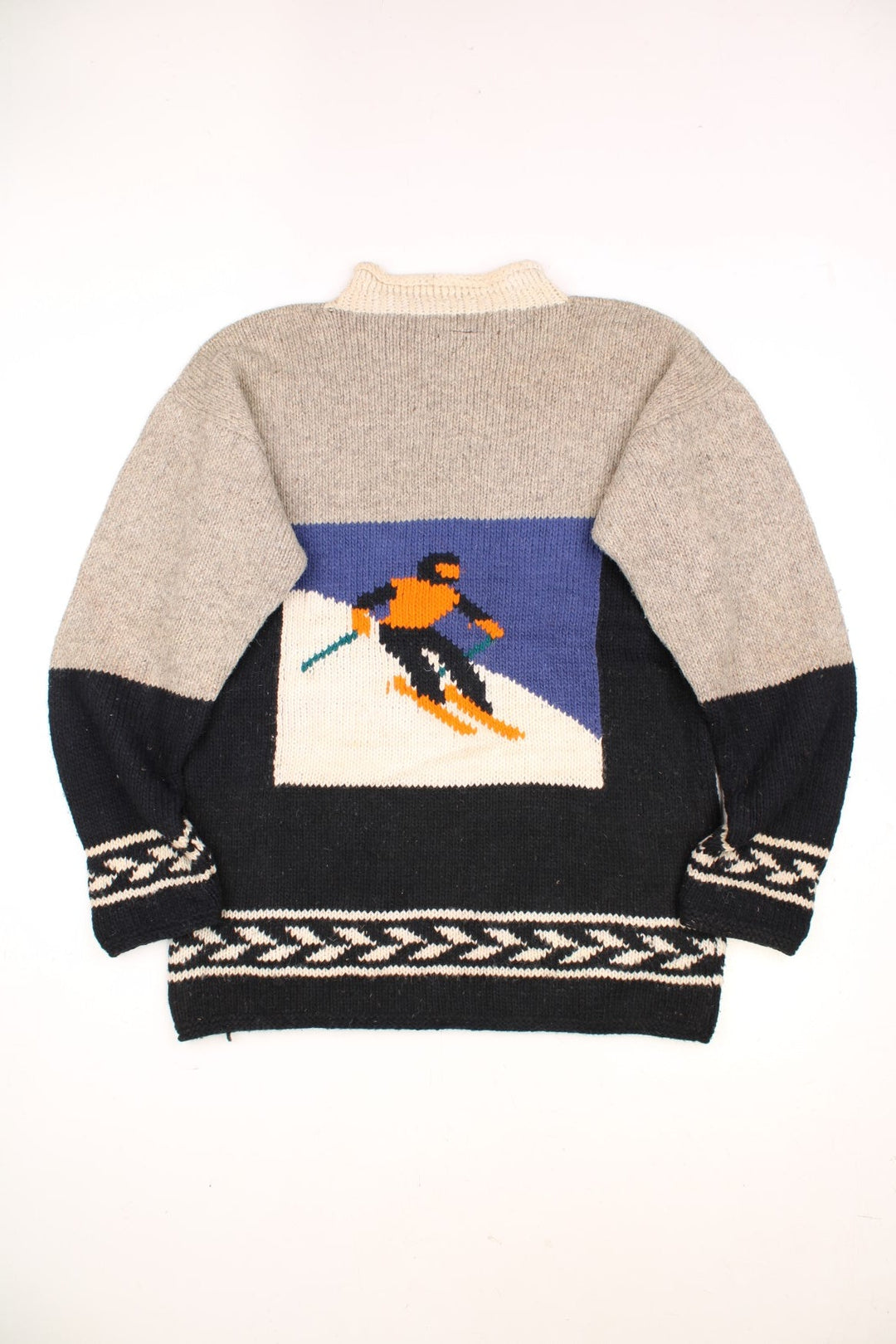 Vintage Yarina Wool Skiing Knitted Jumper in a grey and black colourway with skiing slopes graphic on the front and back. 