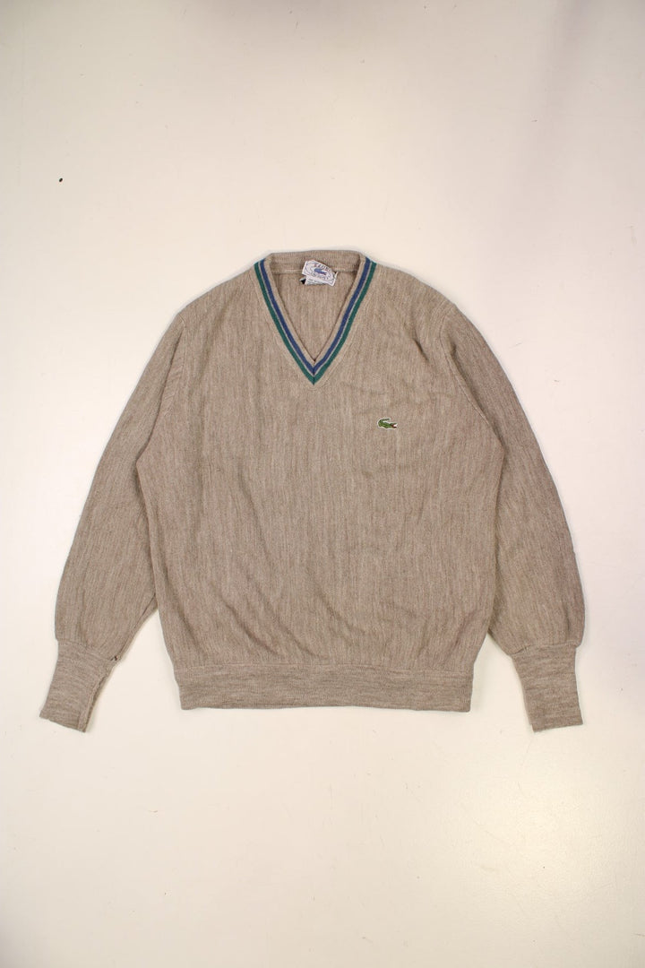 Lacoste lightwright v-neck jumper in tan with blue and green accent stripes, and a crocodile logo embroidered on the front.