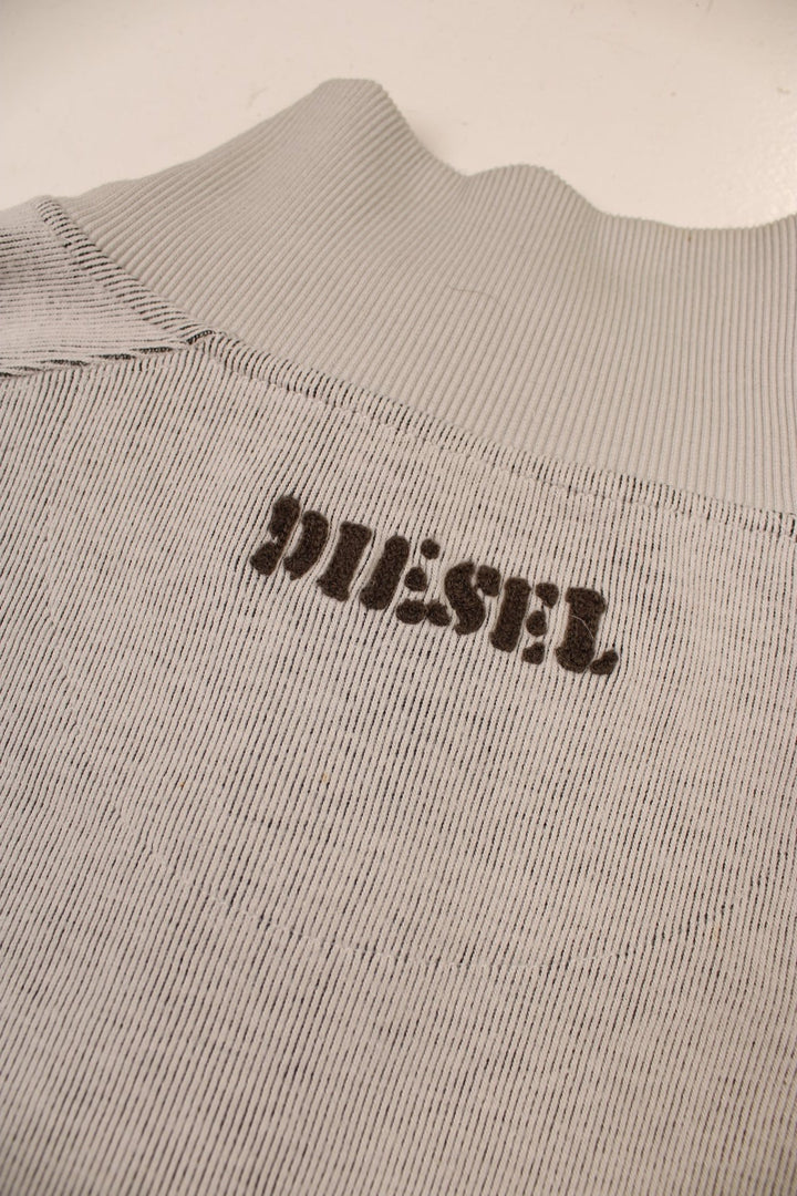 Diesel zip-through raglan sleeve cardigan in pale grey with embroidered spellouts front and back, wing designs, and a logo patch on one sleeve.