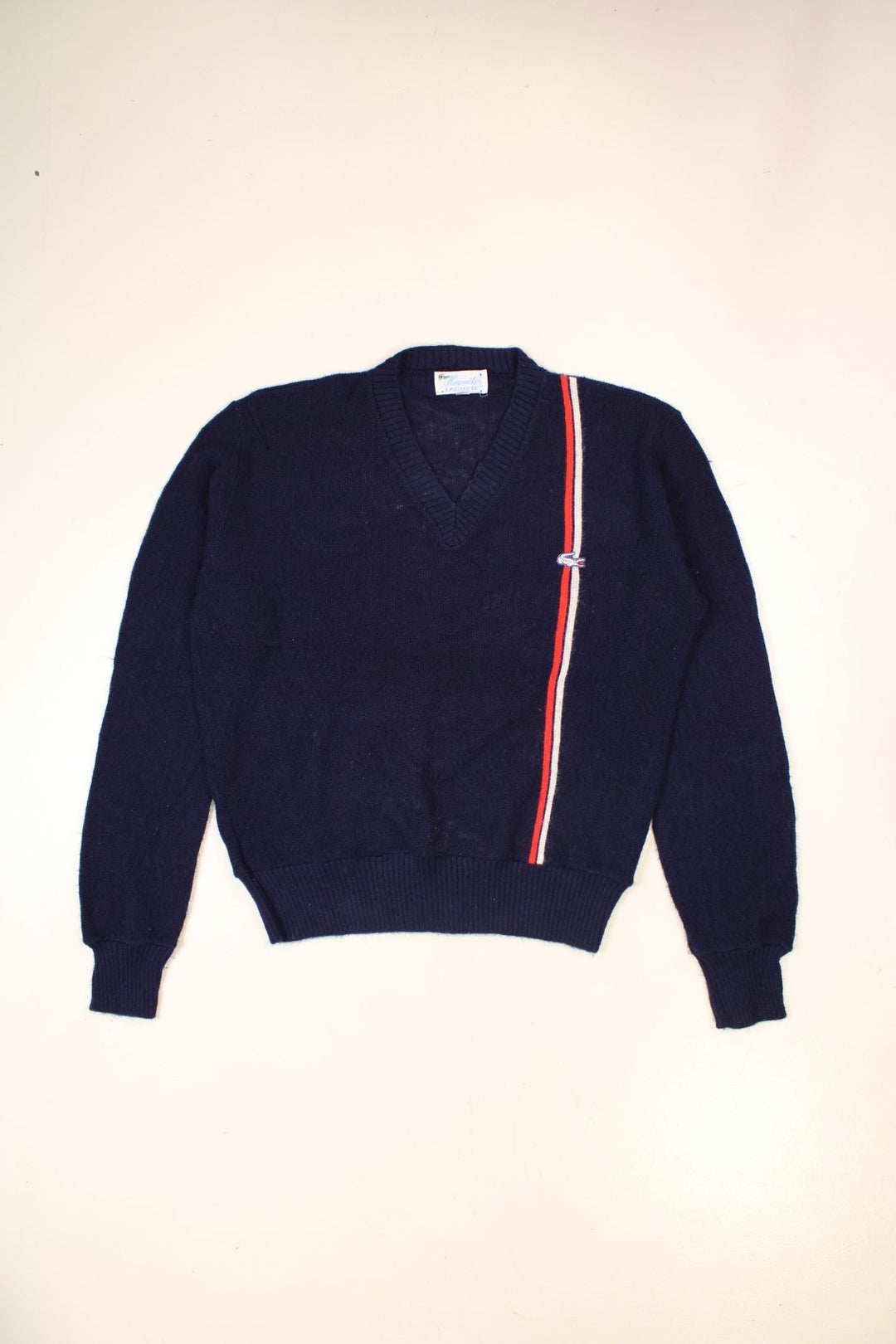 Lacoste lightweight v-neck jumper in navy blue with a red and white accent stripe, and a crocodile logo embroidered logo on the front.