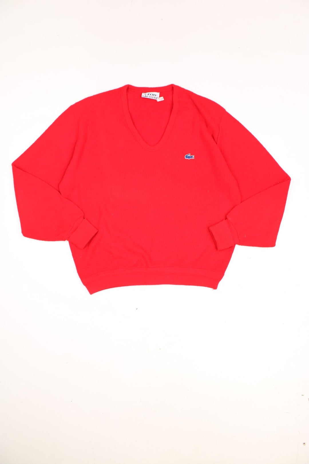 Vintage 70s Lacoste Izod knitted jumper in red. Features signature embroidered logo on the chest.  