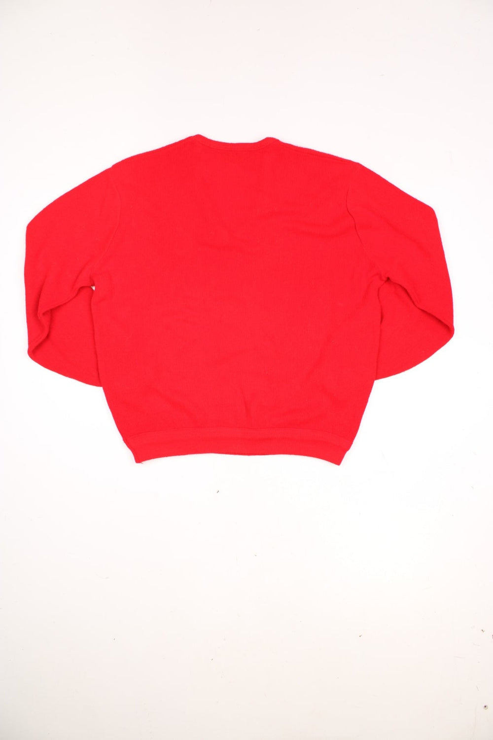 Vintage 70s Lacoste Izod knitted jumper in red. Features signature embroidered logo on the chest.  