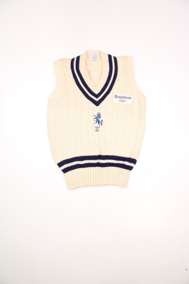 Vintage Allez by MCM sleeveless knitted cricket vest in white and blue. Features embroidered Oranjeboom Lager badge. 