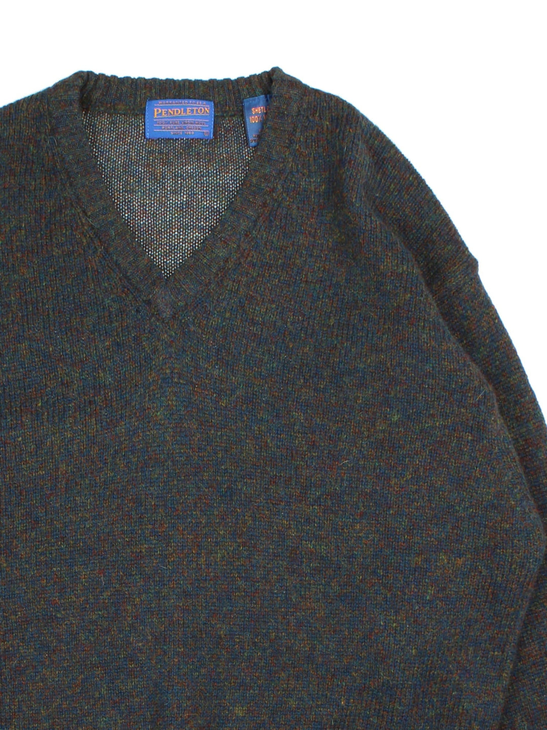 Pendleton Jumper in a blue/brown fleck colourway. V neck and cuffed hems.