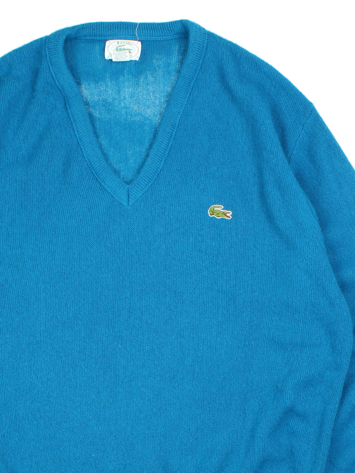 Lacoste IZOD Jumper in a blue colourway. V neck, with cuffed hems and embroided logo.