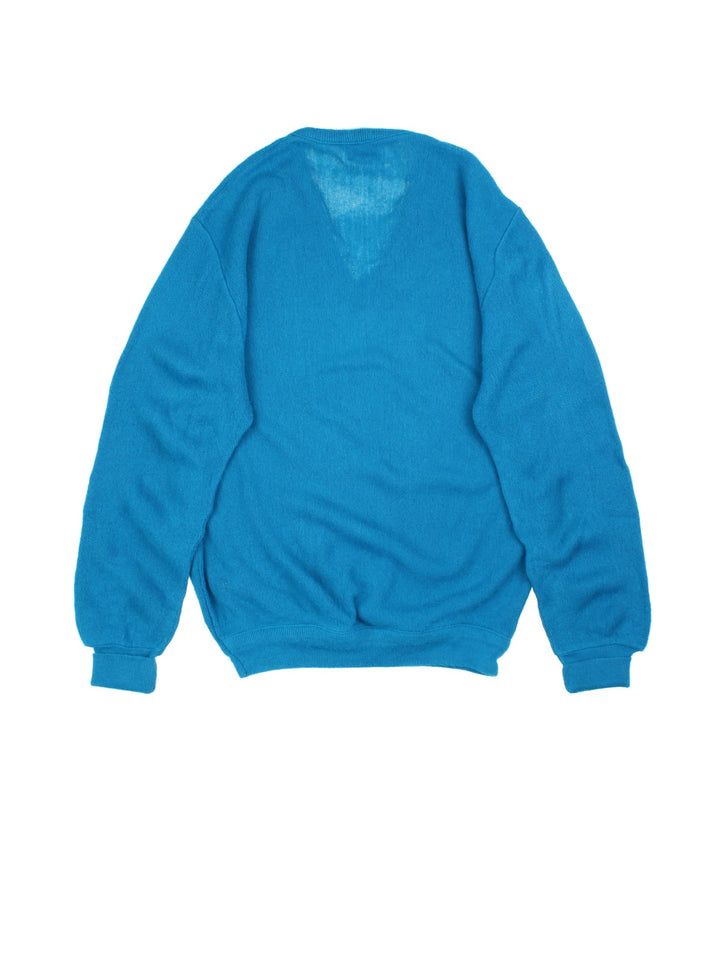 Lacoste IZOD Jumper in a blue colourway. V neck, with cuffed hems and embroided logo.