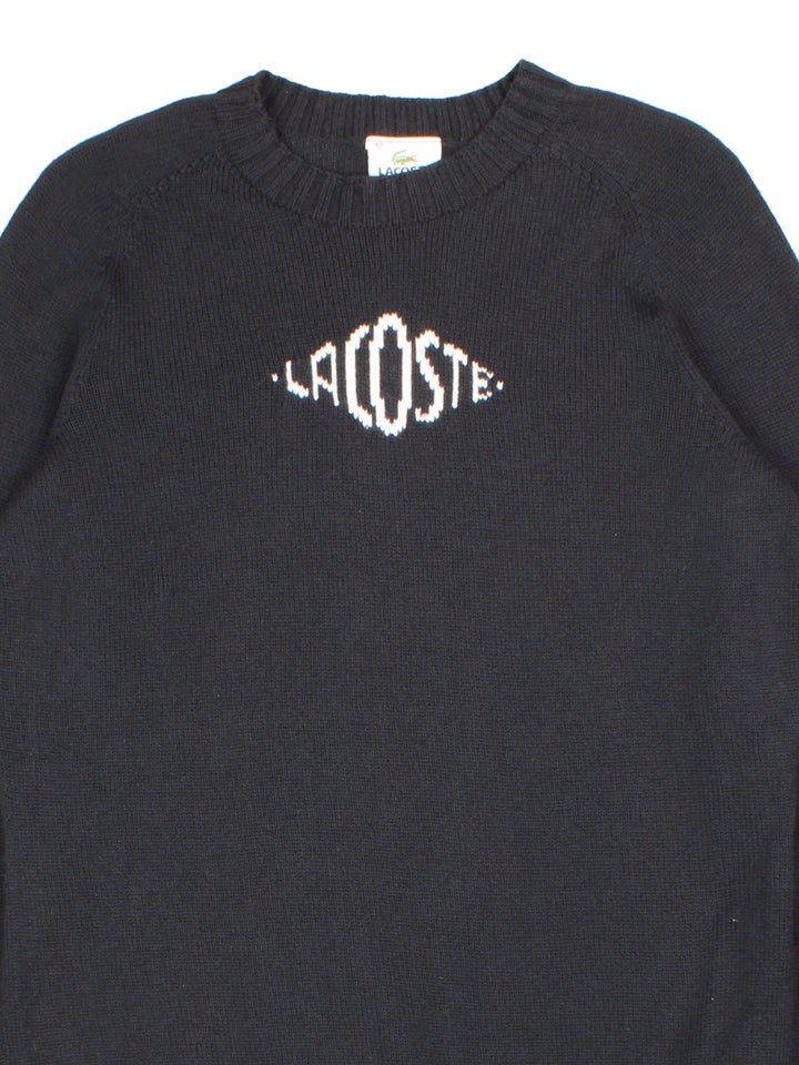 Lacoste Jumper in a black colourway with contrast white knitted branding. Crewneck with cuffed hems.