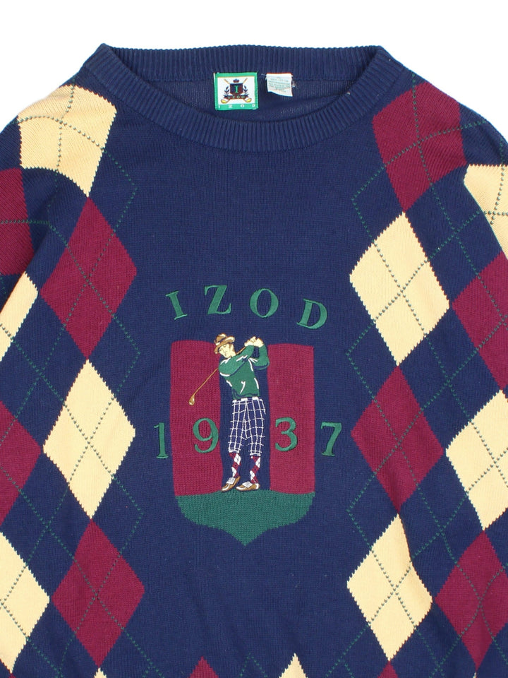 Vintage Izod Golfer jumper in a blue colourway. Golfer and date embroidered on the front with large chequered pattern. 