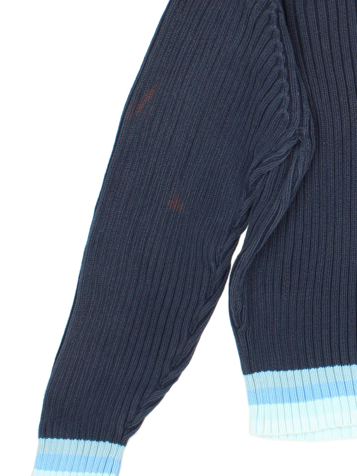 Vintage Adidas roll neck jumper in a blue colourway with embroidered logo on the front. Light blue patterned trim around the sleeves and hem.