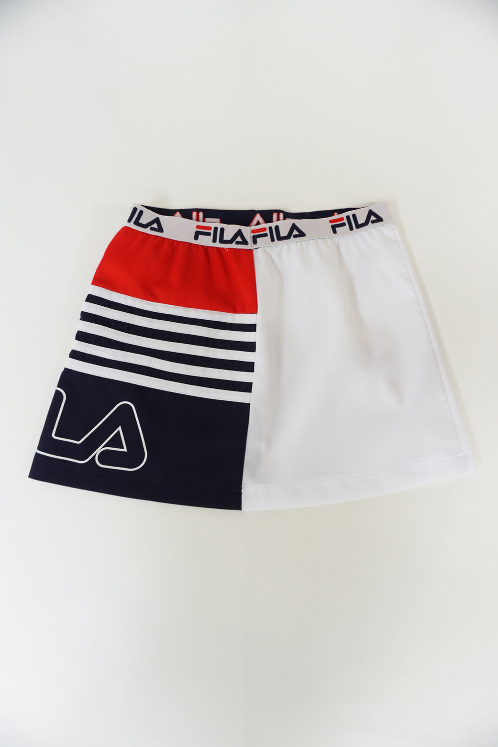 Fila red, white and blue spell-out sporty style mini skirt with elasticated waist 