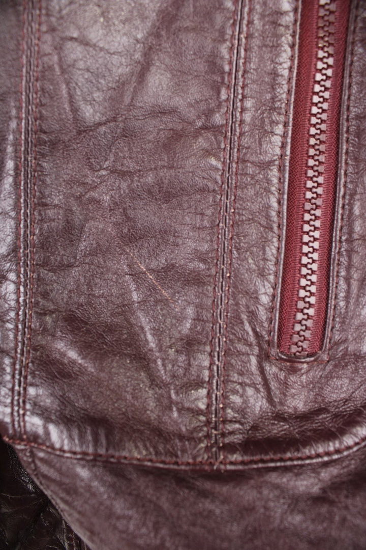 Vintage 70's Wilsons Leather Jacket in a brown colourway, zip up with multiple pockets and has a nylon lining. 