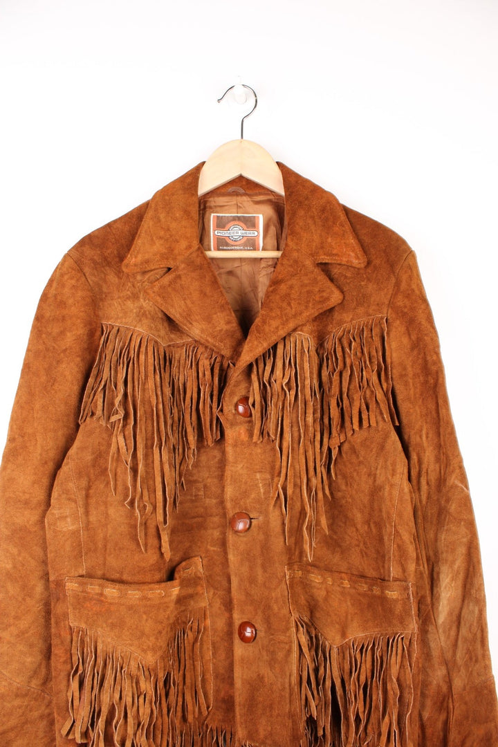 Vintage Pioneer Wear Western Leather Fringe Jacket in a brown colourway, button up with side pockets, big collar, and has fringe tassels throughout. 