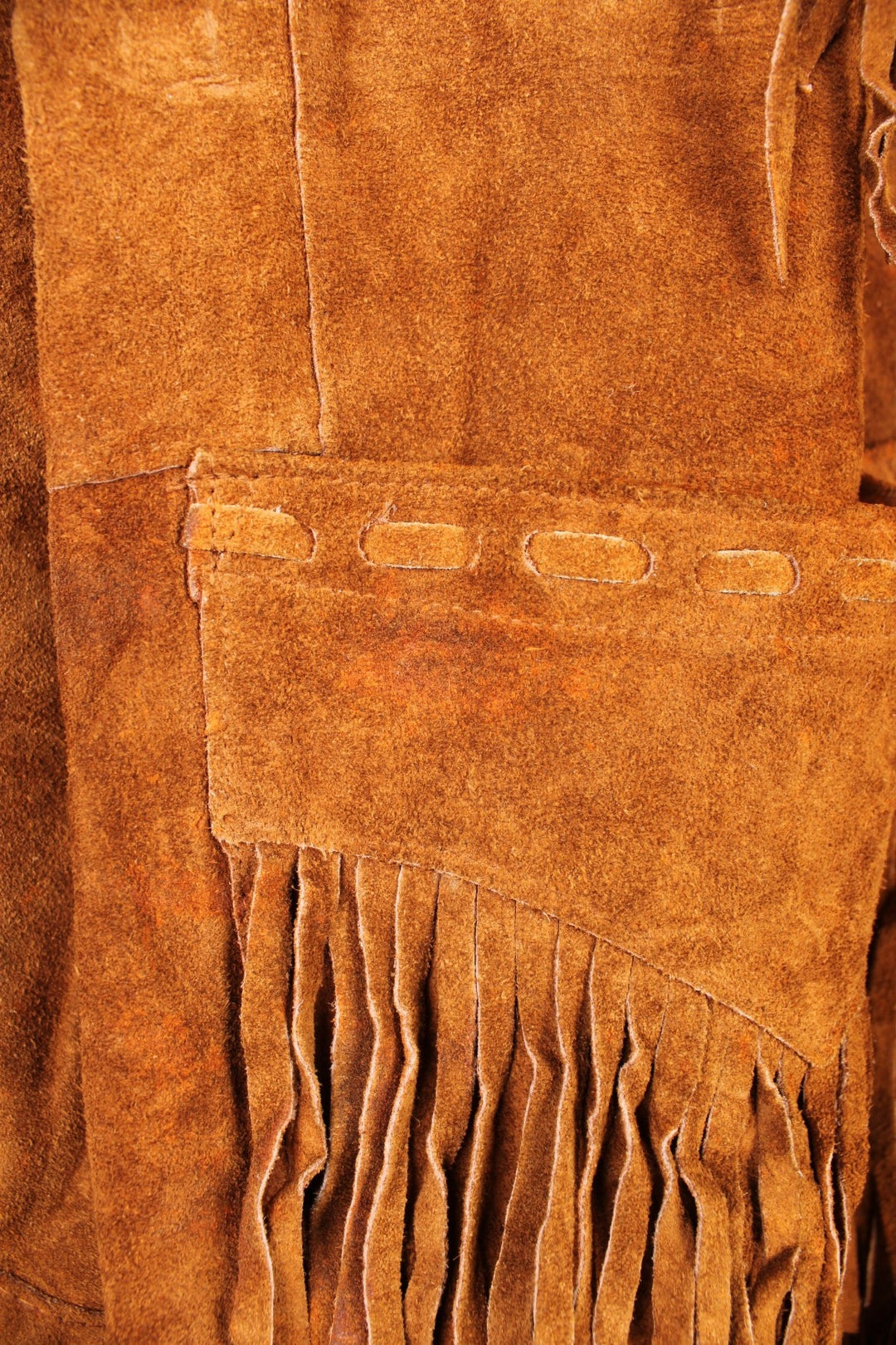 Vintage Pioneer Wear Western Leather Fringe Jacket in a brown colourway, button up with side pockets, big collar, and has fringe tassels throughout. 