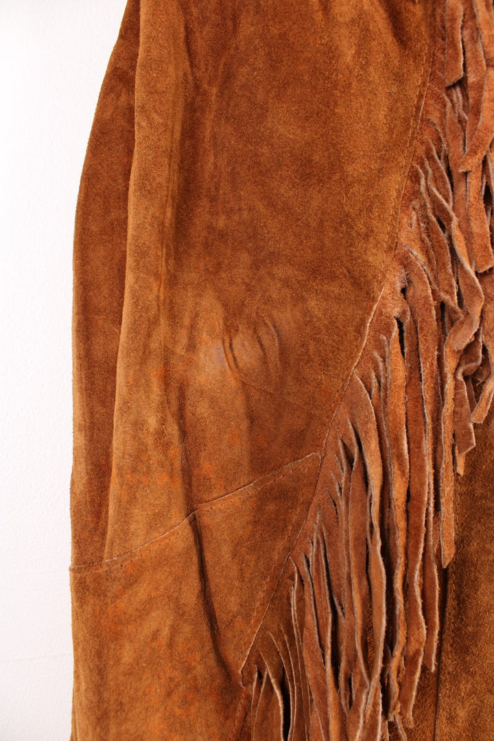 Vintage Pioneer Wear Western Leather Fringe Jacket in a brown colourway, button up with side pockets, big collar, and has fringe tassels throughout. 