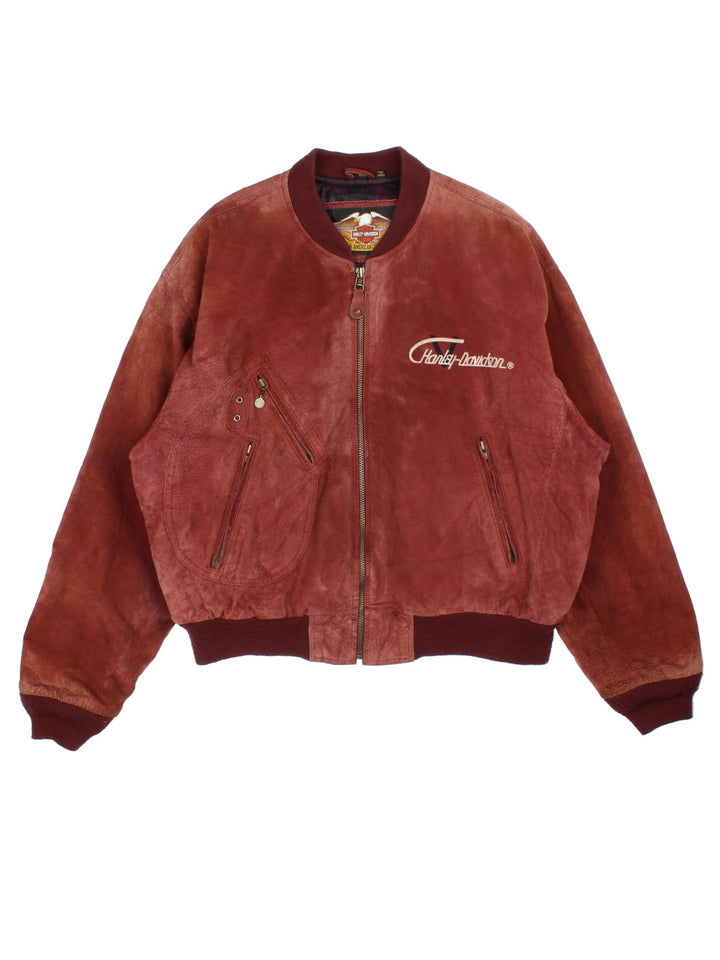 Harley-Davidson Leather Bomber Jacket in a brown colourway. Full zip with multiple pockets on the front and inside. Detailling across the back with V twin badge and crest.