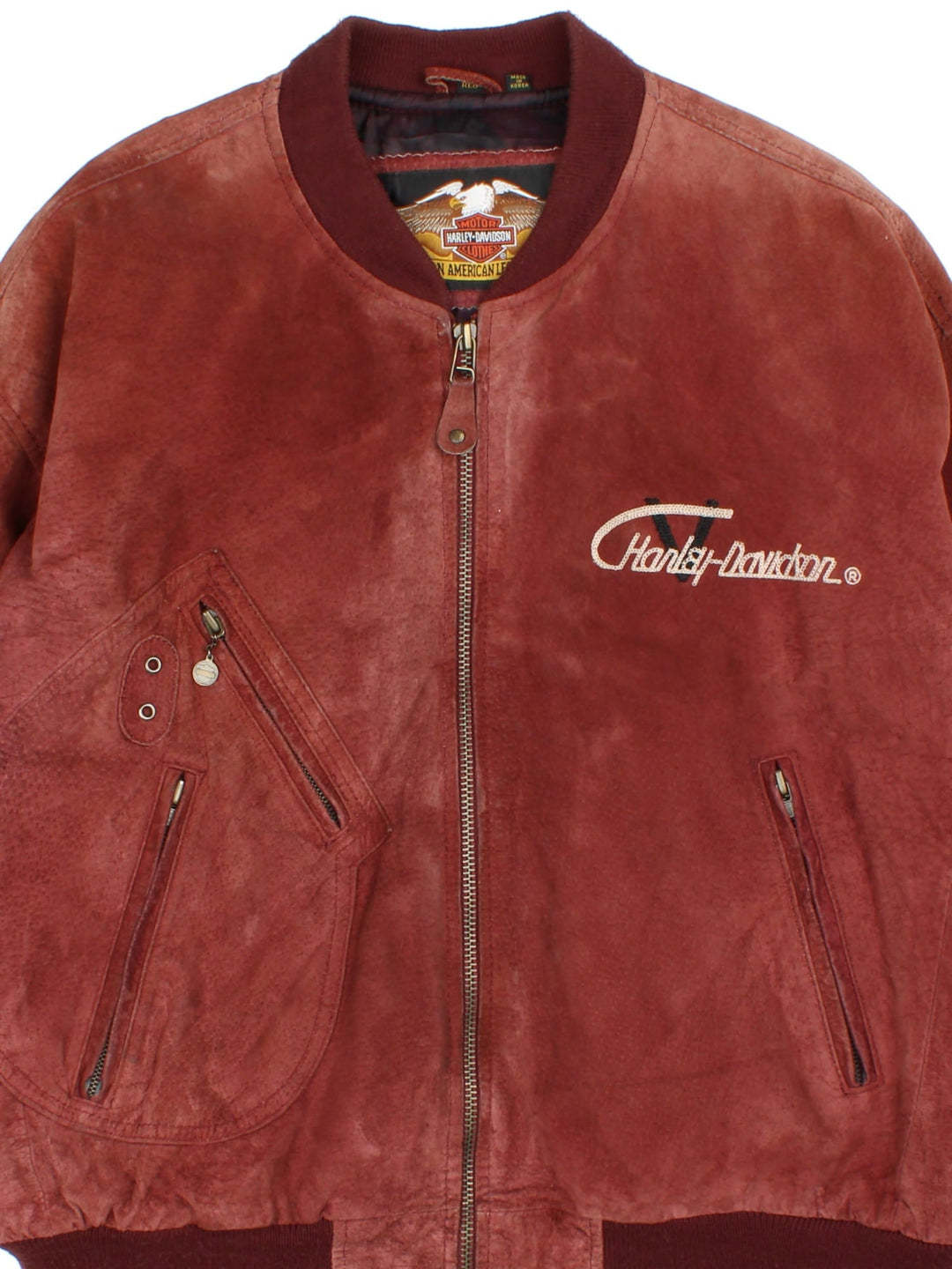 Harley-Davidson Leather Bomber Jacket in a red colourway. Full zip with multiple pockets on the front and inside. Detailling across the back with V twin badge and crest.