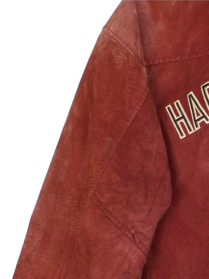 Harley-Davidson Leather Bomber Jacket in a red colourway. Full zip with multiple pockets on the front and inside. Detailling across the back with V twin badge and crest.