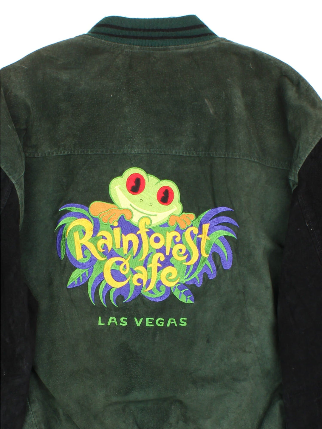 Vintage Rainforest Cafe Bomber Jacket in a green colourway with black sleeves striped cuffed hem. Full zip with double pocket and large logo on the back with Las Vegas lettering.