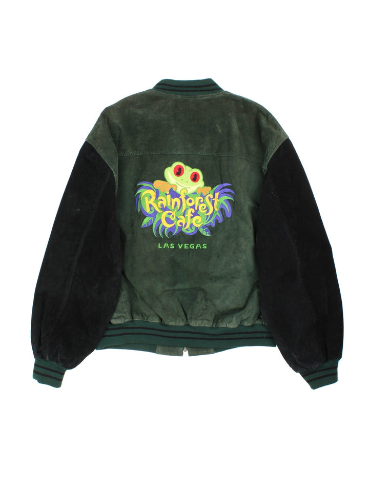 Vintage Rainforest Cafe Bomber Jacket in a green colourway with black sleeves striped cuffed hem. Full zip with double pocket and large logo on the back with Las Vegas lettering.