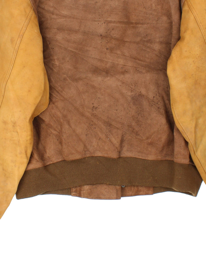 Ralph Lauren Leather Bomber Jacket in a brown colourway. Metal clasps on the front with double pocket, Tan coloured sleeves with brown cuffed hem.