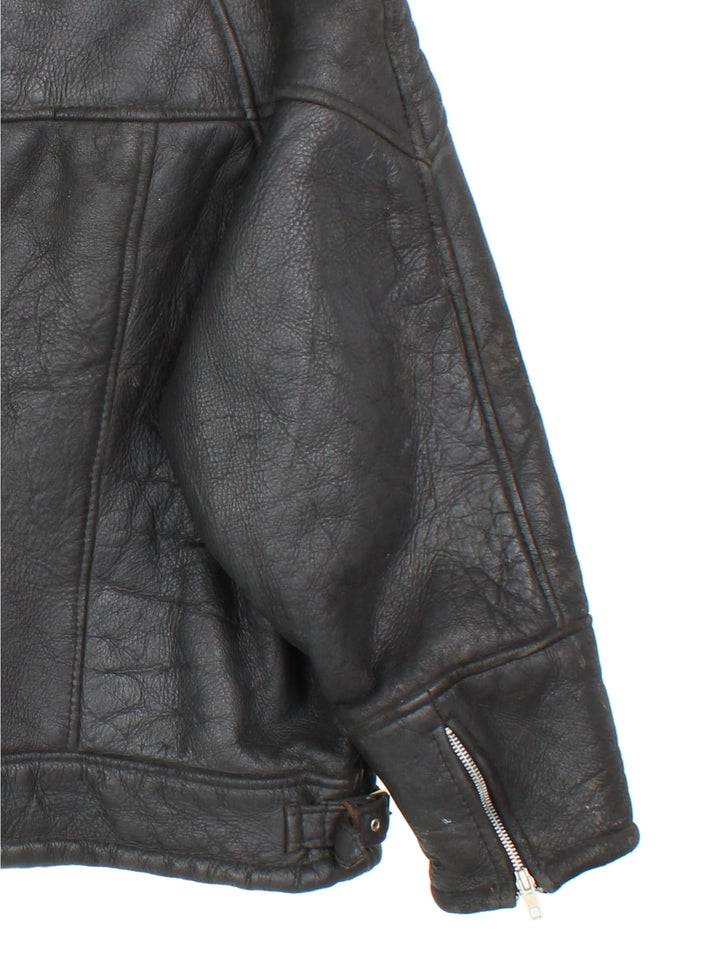 Vintage Leather Shearling Aviator Jacket in a black colourway. Zip up with pockets on front, insulated shearling lining and large collar.